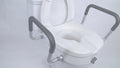 elevated toilet seat with padded armrests